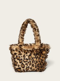 Leopard print mini shoulder bag with furry texture and handles.