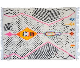 Handmade Berber carpet with abstract geometric patterns in various colors including black, white, pink, and orange. The design features shapes like triangles, zigzags, and dots, creating a vibrant and textured floor covering.
