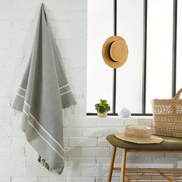 Herringbone fouta beach and hammam towel in various colors including aqua, gris calcé, turquoise, orange, rose bonbon, and more. Made of soft, absorbent material for use at the beach or in the hammam.