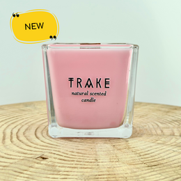 Aromatic natural candle with rose, melon, and vanilla scents, handcrafted in an eco-friendly manner.