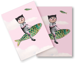 Postcard featuring a young girl riding a colorful fish-shaped surfboard against a pink background.