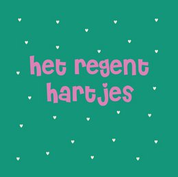 A decorative wall tile or plate featuring the text "het regent hartjes" (it's raining hearts) in pink lettering on a green background with white heart shapes.