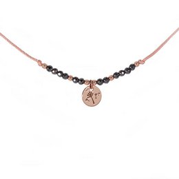 This anklet features a dandelion charm in a rose gold tone, with black beads accenting the chain. The delicate, feminine design is suitable for casual or dressy wear.