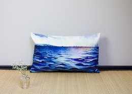 Rectangular mooring cushion with a vibrant blue ocean scene printed on it. The cushion has a soft, plush texture and is suitable for indoor or outdoor use.