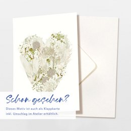 Postcard heart made of cream-colored flowers
