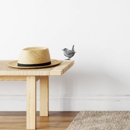 Decorative wall sticker featuring a detailed illustration of a wren bird. The sticker has a natural, minimalist design that would complement a variety of home decor styles.
