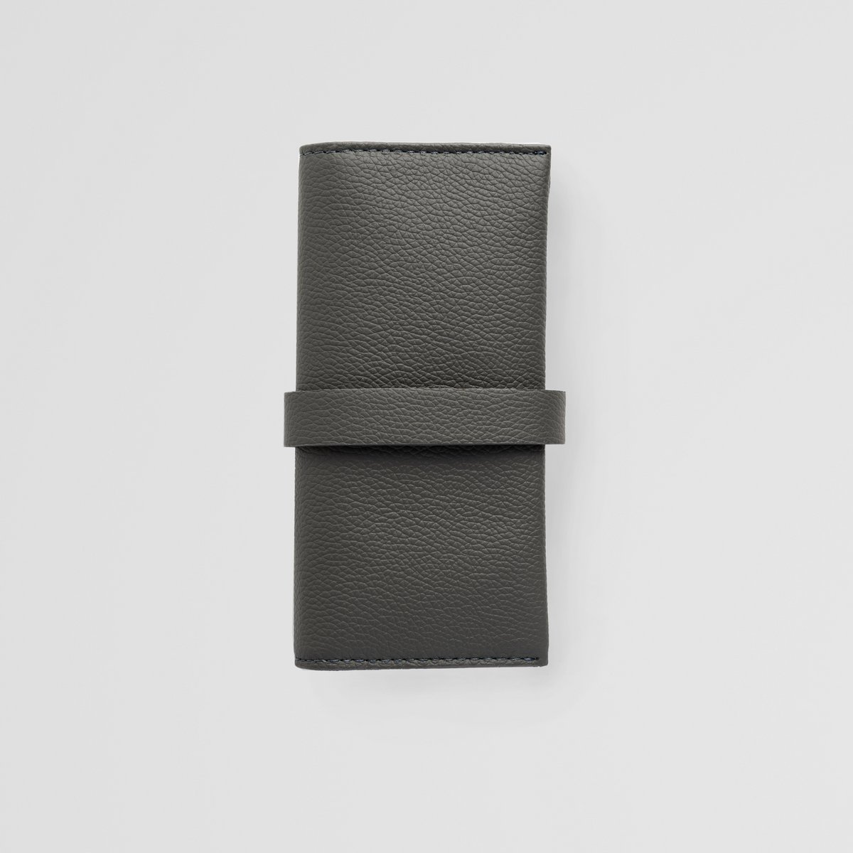 Minimalistisches graues Uhrenrollenetui aus Leder. Lederetui für Uhren