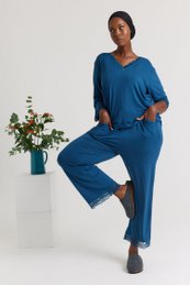 Teal bamboo lace v-neck pajama set for women, featuring a v-neck top and matching pants in a teal color. Available in sizes 36-48.