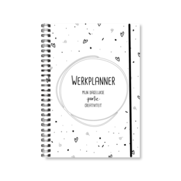 A5 size spiral-bound work planner with a minimalist black and white design featuring various icons and text elements. The planner appears to be intended for organizing tasks, schedules, and creative work.