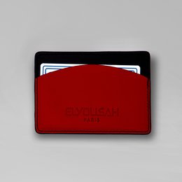 Red leather card holder with minimalist design, suitable for storing credit cards, business cards, and other small items.