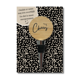 Wooden bottle stopper with "Cheers" text and patterned design, suitable for sealing wine or liquor bottles.