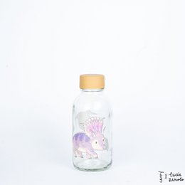 A clear glass bottle with a yellow cap, featuring a cute dinosaur design. The bottle is 0.4 liters in size and is part of the Kids Bottles category.