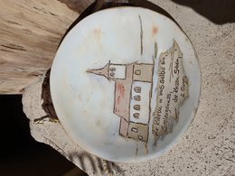 Decorative plate with hand-painted landscape motif featuring a church building. Suitable for home decor or as a unique gift item.