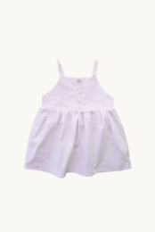 A white dress with a ruffled bodice and buttons down the front. The dress has a flared skirt and is suitable for a young child.
