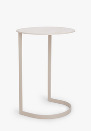 Taupe metal side table with curved, minimalist design. Suitable for use as an end table or accent piece in living rooms and bedrooms.