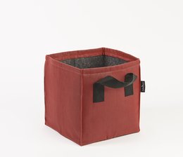 A red, square-shaped plant pot made of fabric material. The pot has a simple, minimalist design with the letter "n" printed on the front.
