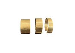 Gold brass bangle bracelets, wide cylindrical cuff style, metallic finish, set of three, ethnic design.