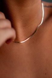 Rose gold chain necklace with a simple, elegant design.