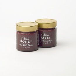 Honey with wild berries, available in 300g, 200g, 100g, and 50g jars. The honey has a rich, floral flavor with notes of wild berries.