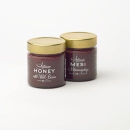 Honey with wild berries, available in 300g, 200g, 100g, and 50g jars. The honey has a rich, floral flavor with notes of wild berries.