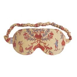 Floral patterned sleep mask with soft, comfortable fabric. Features a relaxing, whimsical design in shades of pink, purple, and beige.