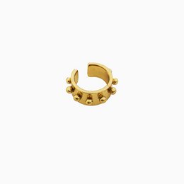 Silver-toned ear cuff with large dotted design, suitable for statement earring fashion.