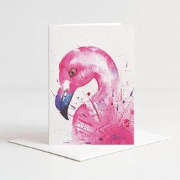 Colorful flamingo-themed greeting card with envelope.