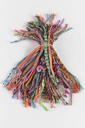 Assorted colorful Brazilian bracelets, handmade with vibrant threads and patterns.
