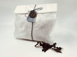 Seaweed bath bag containing dried seaweed for a relaxing, natural bath experience.