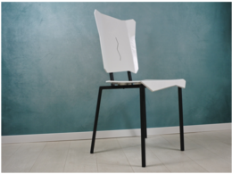 A modern, minimalist white chair with abstract shapes and a unique design, suitable for a variety of interior styles.