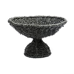 Black woven seagrass fruit bowl, pedestal base, textured natural fiber platter, decorative serving dish.