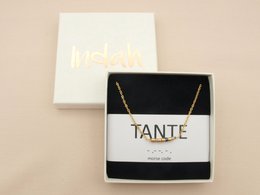 Elegant Morse code necklace in silver, rose-beige, and gold tones. Features the word "Tante" (Aunt) in a stylish pendant.
