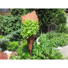 Rust decorative plant bag with rod, handmade patina garden decoration, tall rust bag for planting, features rustic metal design.