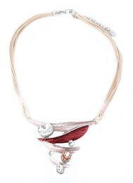Elegant beige gray lace necklace with a striking red and silver geometric pendant. Features a delicate chain and intricate design.