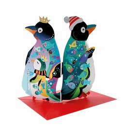 Colorful penguin-shaped advent calendar with festive patterns and decorations, including crowns, stars, and other holiday-themed elements.