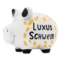  Ceramic piggy bank in the shape of a medium-sized pig, with a white and black color scheme and yellow polka dot accents. The text on the piggy bank reads "Luxus Schwein" which means "Luxury Pig" in German.