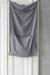 Linen laundry bag in various colors and sizes, including natural linen, off-white, white, pale dogwood, frozen cranberry, rust, mustard, forest green, green moss, dark green, dusk blue, glacier gray, lavender, dusty purple, charcoal gray, graphite gray, black, small gray checks, and natural black stripes.