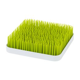 Grass green kids food accessory with tall, thin blades of grass-like material in a square white tray.