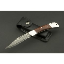 A high-quality pocket knife made of Japanese VG-10 Damascus steel with a leather case. The knife features a unique and stylish design with a wooden handle.