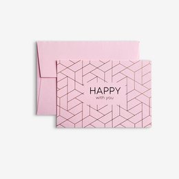 A pink greeting card with a geometric pattern and the text "HAPPY with you" printed on it. The card comes with an envelope.