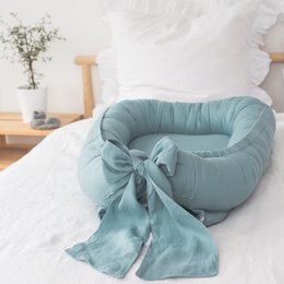 Leinen-Babynest mit Schleife (7 Farben)