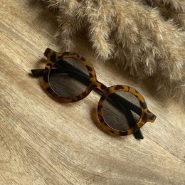 Tortoiseshell-patterned sunglasses with a tiger print design, suitable for kids.
