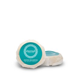 Solid shampoo bar, 50 g, green color, circular shape, natural ingredients, eco-friendly packaging.