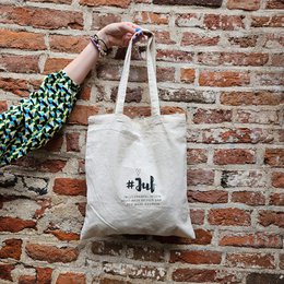 A white cotton tote bag with the text "#3uf" printed on it. The bag appears to be made of a durable, natural material and has a simple, minimalist design.
