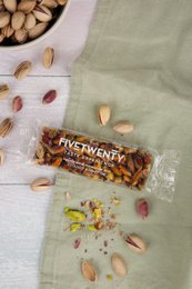 Energy bar with pistachios and honey, 30 grams. Snack bar made with nuts, honey, and other natural ingredients.