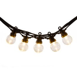 Round, globe-shaped patio lights on a string with a warm, ambient lighting effect. Suitable for outdoor use to create a cozy atmosphere.