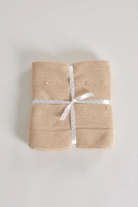Coperta in maglia di cotone per bambini con pompon