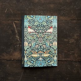  A green and blue patterned notebook with a bird and floral design, suitable for writing and note-taking.