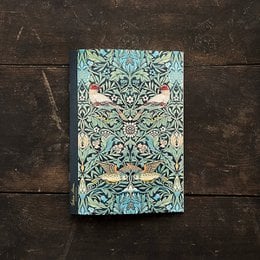 A green and blue patterned notebook with a bird and floral design, suitable for writing and note-taking.