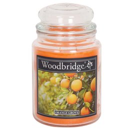 Large, round, orange-scented candle in a glass jar with a white lid.